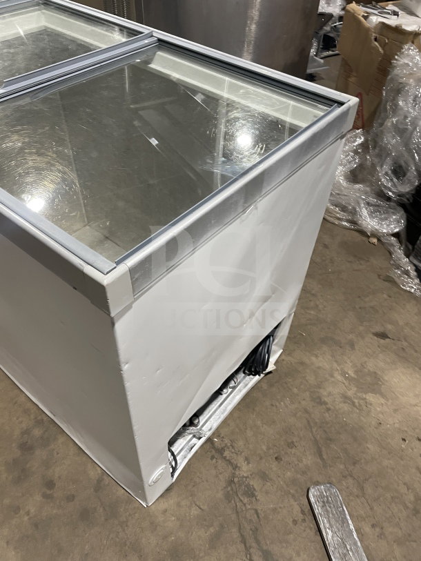Commercial white 46" ice cream dipping cabinet with curved glass and rear lift-open access, in good condition.