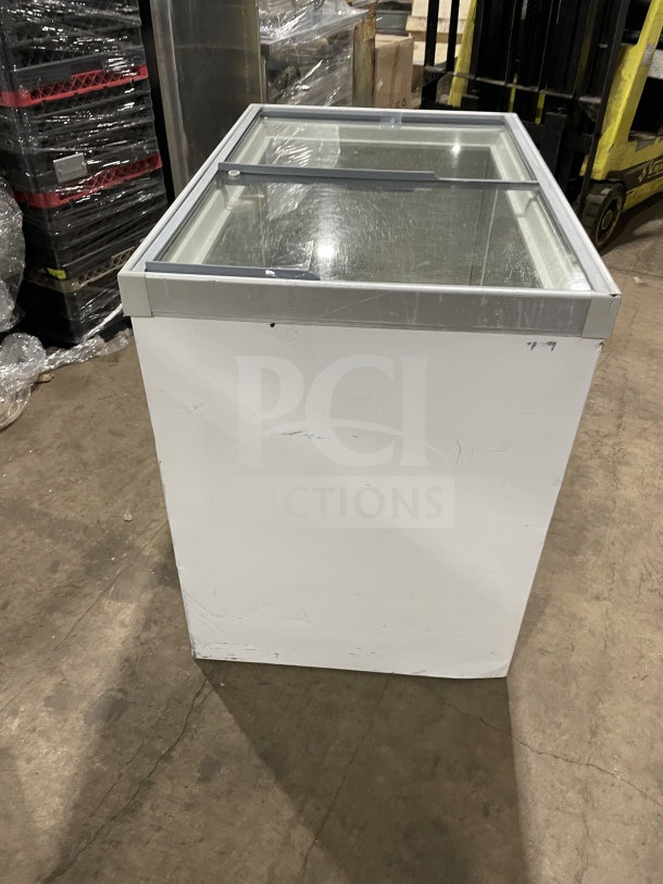 Commercial white curved glass ice cream dipping cabinet, 46", with rear lift-open access, used condition, visible scratches.