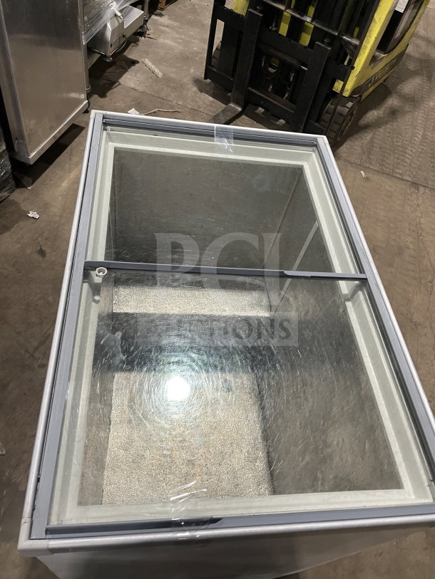 Commercial white curved glass 46" ice cream dipping cabinet with rear lift-open access, stainless interior, excellent condition.