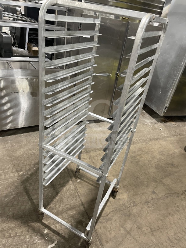 Commercial stainless steel heavy-duty pan sheet rack on casters, featuring multiple shelves, excellent condition.