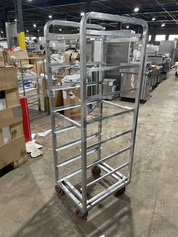 Channel stainless steel end load mobile bun/sheet pan rack with wire slides, on casters, excellent condition.