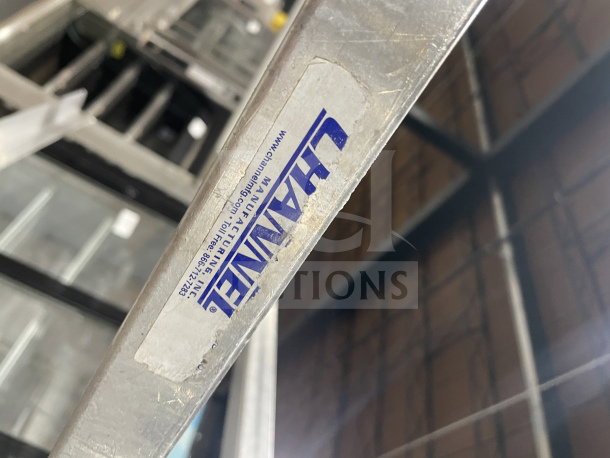 Channel commercial stainless steel bun/sheet pan rack with wire slides, on casters. Visible Channel label.