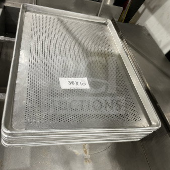 Commercial stainless steel perforated full-size sheet pan in good condition, stack of ten, label reads "36 X 10".