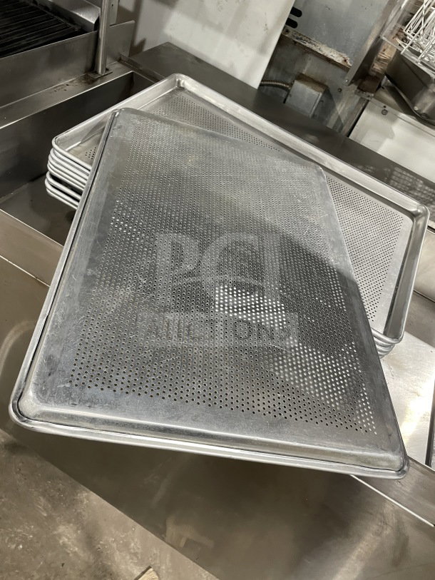 Commercial stainless steel perforated sheet pan, full-size, durable, used condition, ideal for professional kitchens.