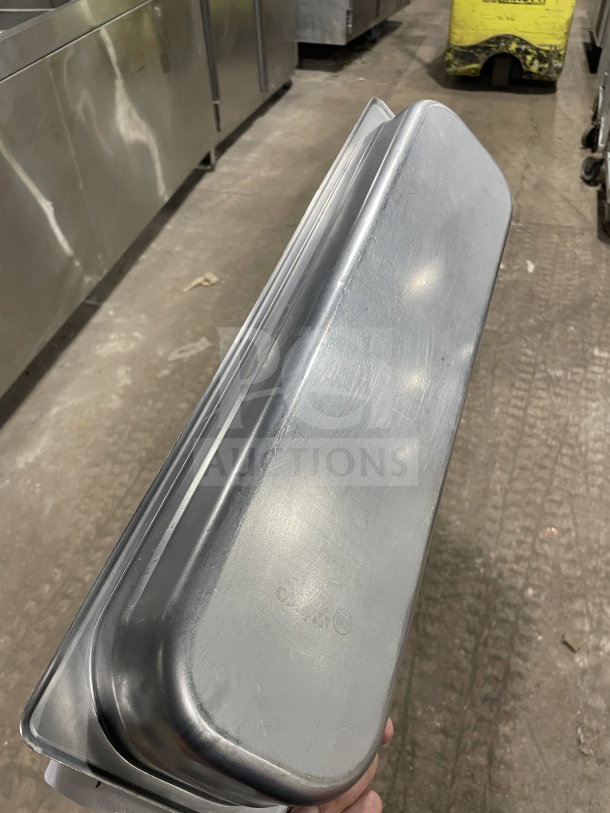 Winco commercial stainless steel full-size hotel pan in good condition, visible brand marking, ideal for steam tables.
