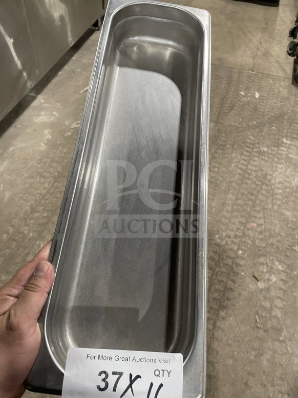 Winco commercial stainless steel full-size hotel pan. Rectangular, good condition, durable material. Marked quantity tag visible.