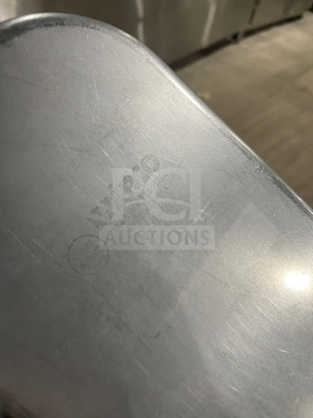 Winco commercial stainless steel full-size hotel pan, featuring visible brand marking. Ideal for steam tables. Light wear evident.