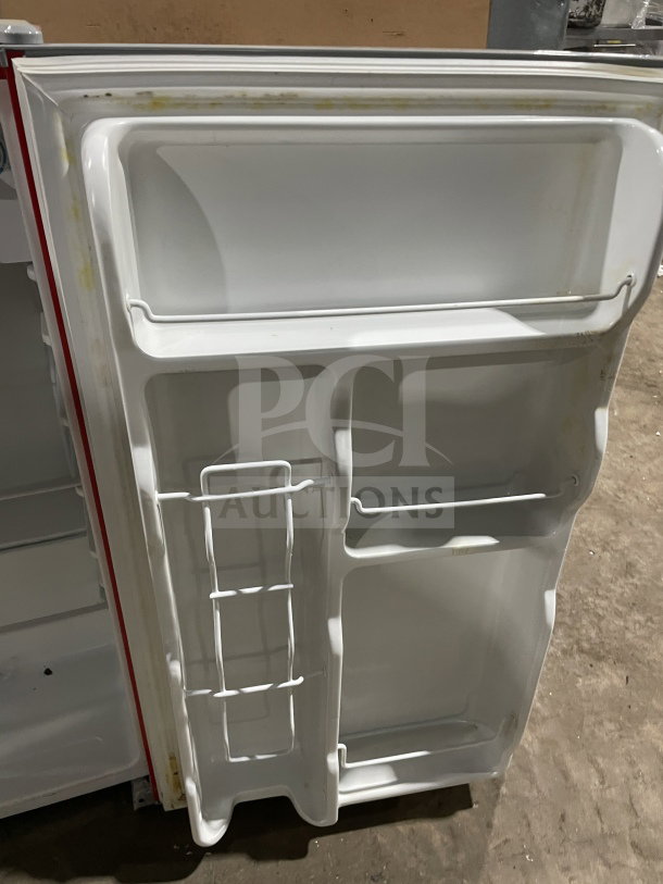 RCA RFR320-B-RED-COM refrigerator/freezer, single red door, poly-coated wire rack, Energy Star certified, 115V, SN: 3082427.