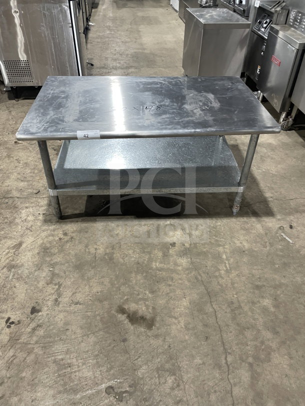 L&J commercial stainless steel worktop table with undershelf, on legs. Visible markings: "60x48". Good condition.