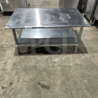 L&J commercial stainless steel worktop table with undershelf, on legs. Visible markings: "60x48". Good condition.