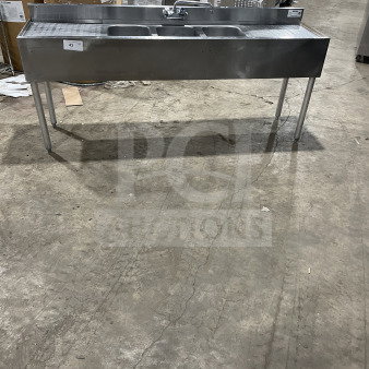 Krowne commercial stainless steel 3-compartment underbar sink with left and right side drainboards, backsplash, and legs.