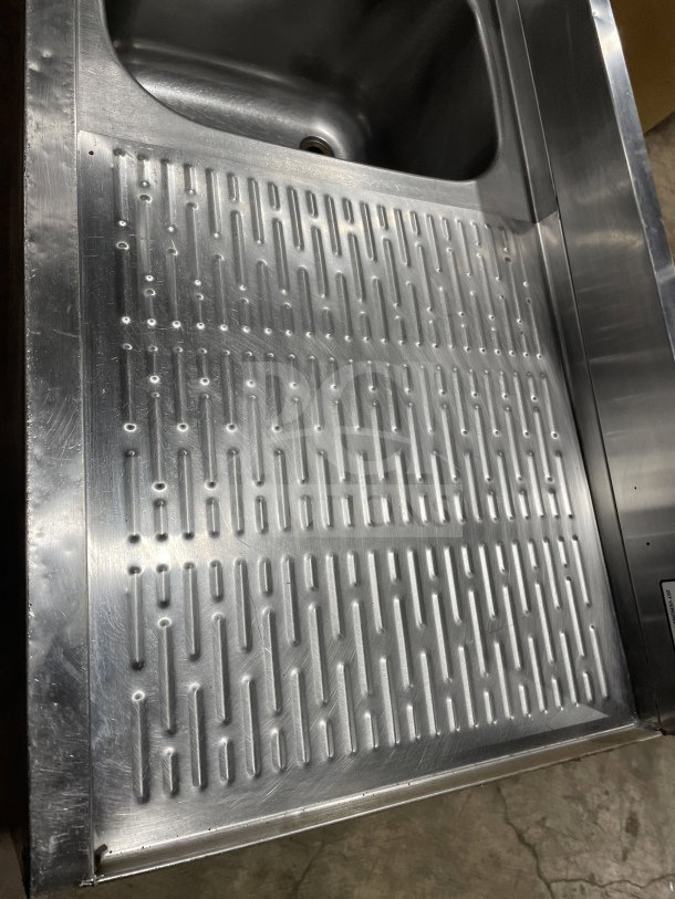 Krowne stainless steel 3-compartment underbar sink, with left and right side drainboards, backsplash, on legs, commercial use.