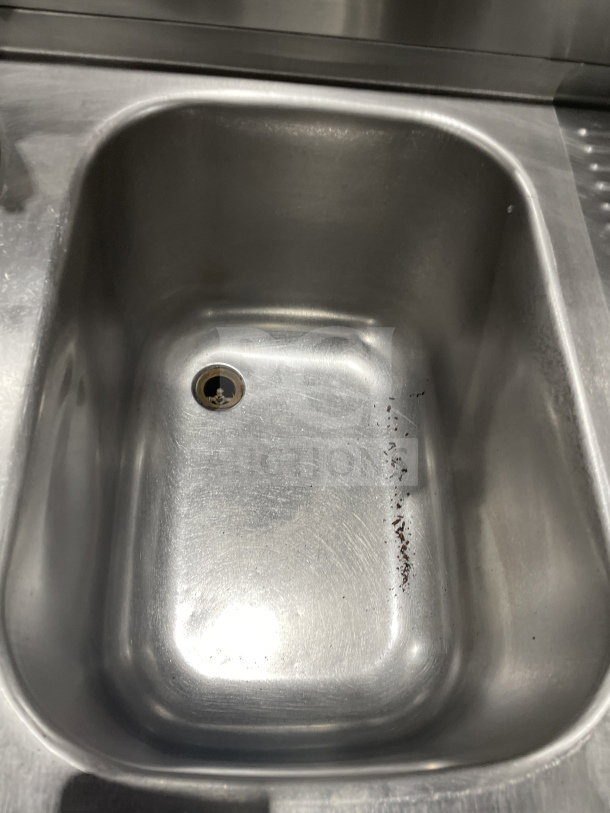 Krowne stainless steel 3-compartment underbar sink with left and right drainboards, backsplash, and leg support.