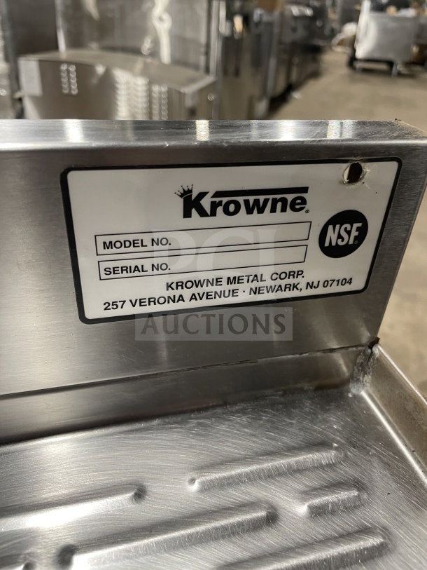 Krowne commercial stainless steel 3-compartment underbar sink with side drainboards and backsplash. Label indicates NSF approval.