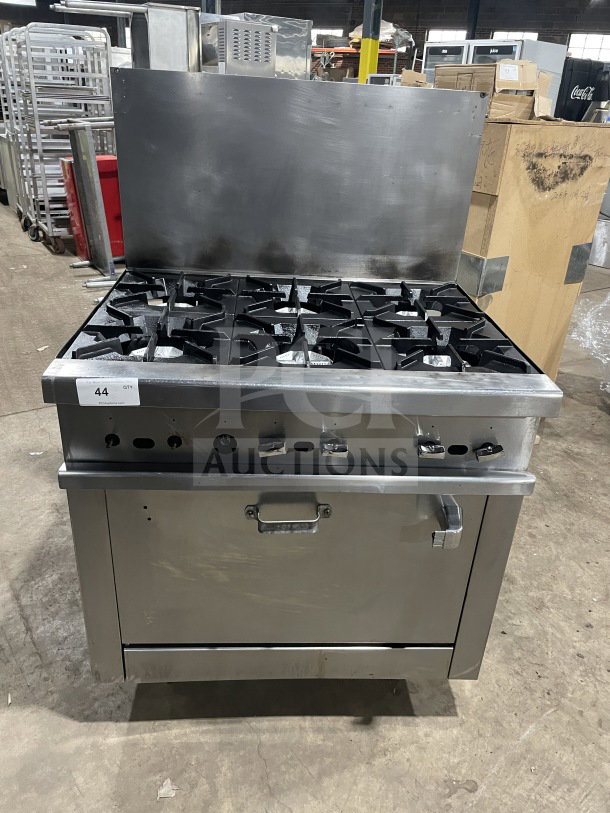 Commercial stainless steel gas 6-burner range/oven, with backsplash, overhead salamander shelf, wired oven rack, on casters.