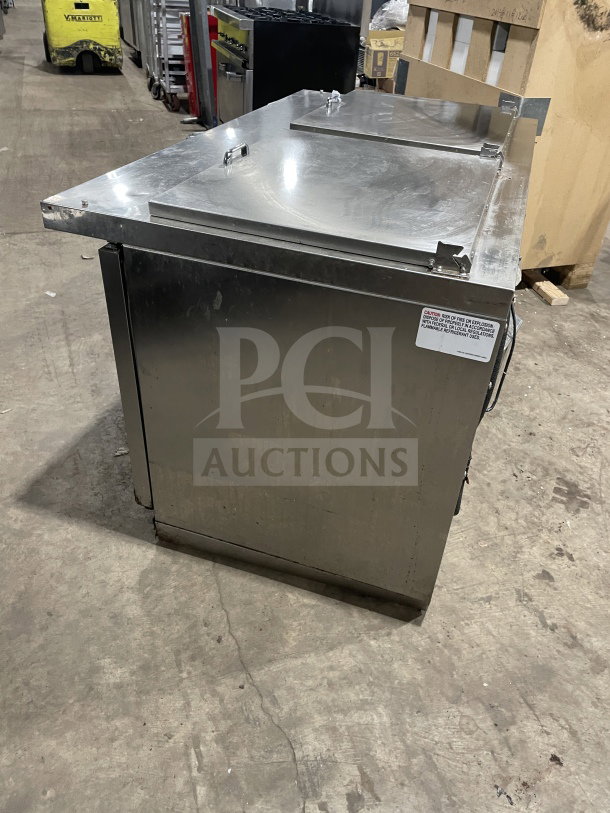 Continental stainless steel 2-door refrigerated prep table, Model SW72 18, with wired rack. Slight wear visible, 115V 1 Phase.