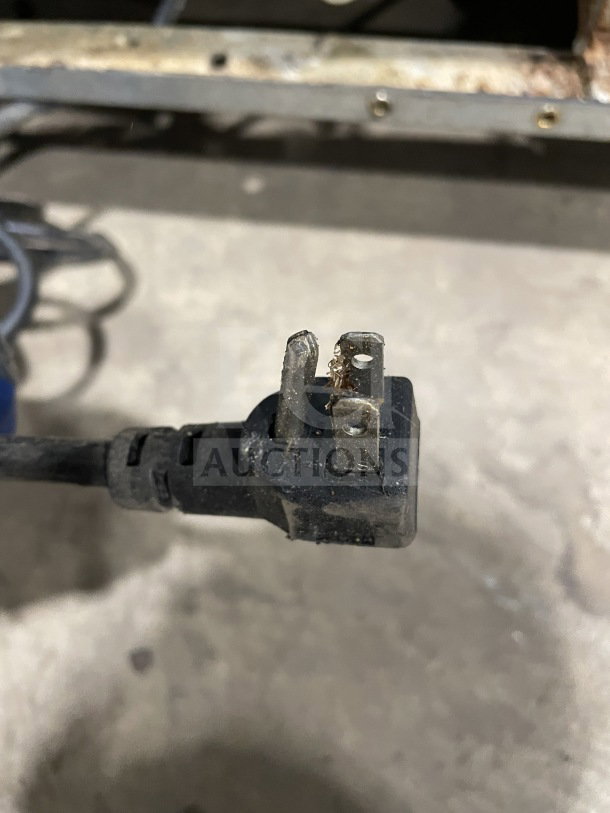Image shows a worn electrical plug with bent and frayed prongs. Suitable for Continental SW60N24M prep table, 115V, 1 phase.