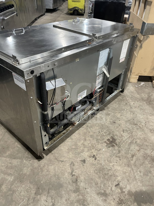 Continental SW72 18 commercial stainless steel 2-door refrigerated prep table with wired rack, visible labels and wiring, used condition.