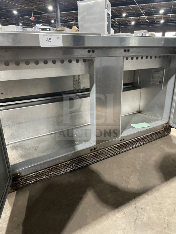 Continental stainless steel 2-door refrigerated prep table, model SW72 18, with wired rack, visible mild wear.