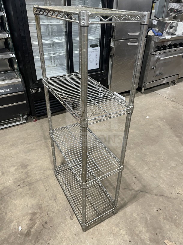 Uline Commercial 4-Tier Chrome Wire Shelving Unit, used condition, sturdy construction, ideal for storage or display.