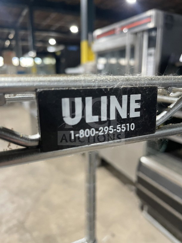 Uline Commercial 4-Tier Chrome Wire Shelving Unit, visible Uline label with contact number. Sturdy chrome construction.
