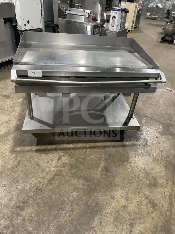Vulcan 48" stainless steel flat griddle, model 48RRGCKR1, with back and side splashes, storage, and casters; excellent condition.