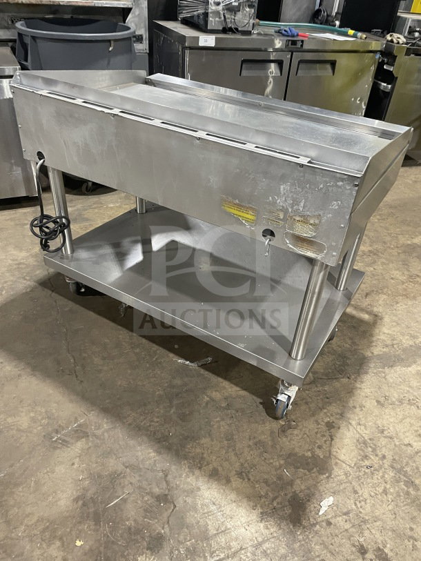 Vulcan 48" stainless steel flat griddle, model 48RRGCKR1, on casters with back and side splashes. Features underneath storage.