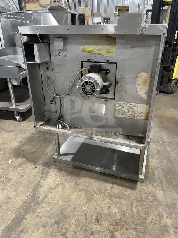 US Range SUMG100 commercial stainless steel single deck convection oven, natural gas powered, on stand with storage space.