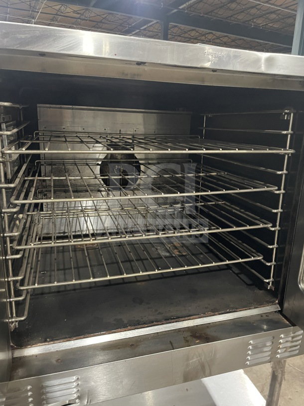 US Range SUMG100 stainless steel convection oven, natural gas, view-through doors, wired rack, on stand with storage.