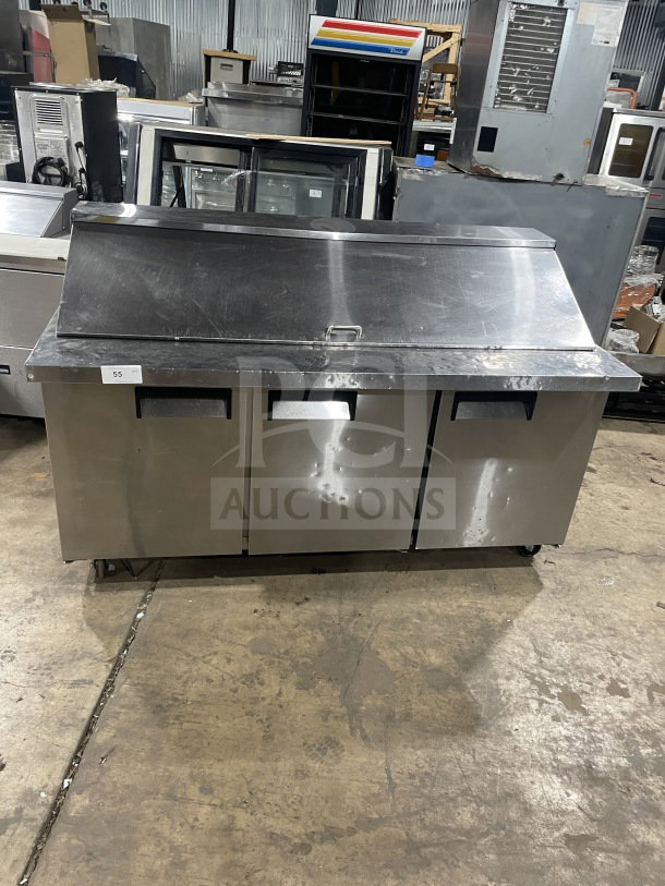 Commercial stainless steel 3-door bain marie sandwich prep refrigerator, Model SC72BMI, on casters, with poly coated rack.