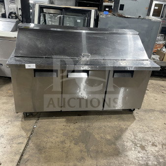 Commercial stainless steel 3-door bain marie sandwich prep refrigerator, Model SC72BMI, on casters, with poly coated rack.