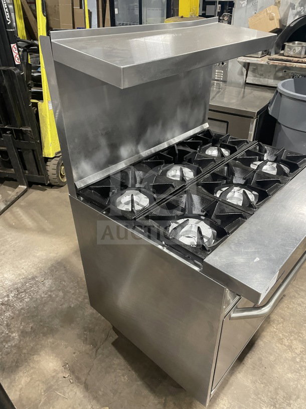 Bakers Pride 6-burner stainless steel gas range/oven, model 36BP6BS30N, with backsplash and salamander shelf.
