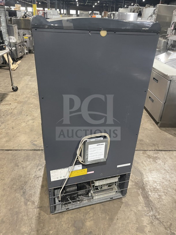 AHT refrigerated open grab-n-go case, model AC S LED, with pull-down night shade and LED lights, on casters.