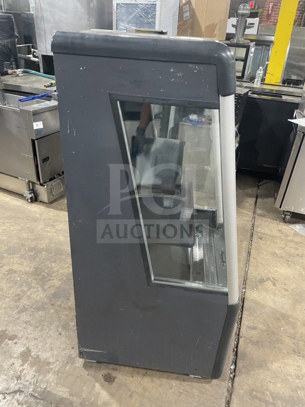 AHT 2013 refrigerated open grab-n-go merchandiser, model AC-S LED, with pull-down night shade, LED lights, on casters.