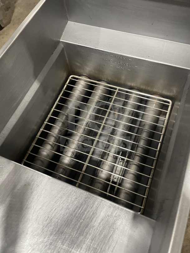 Pitco SFSG14 JS commercial stainless steel deep fat fryer, 40 lb. capacity, visible oil level markings, on casters.