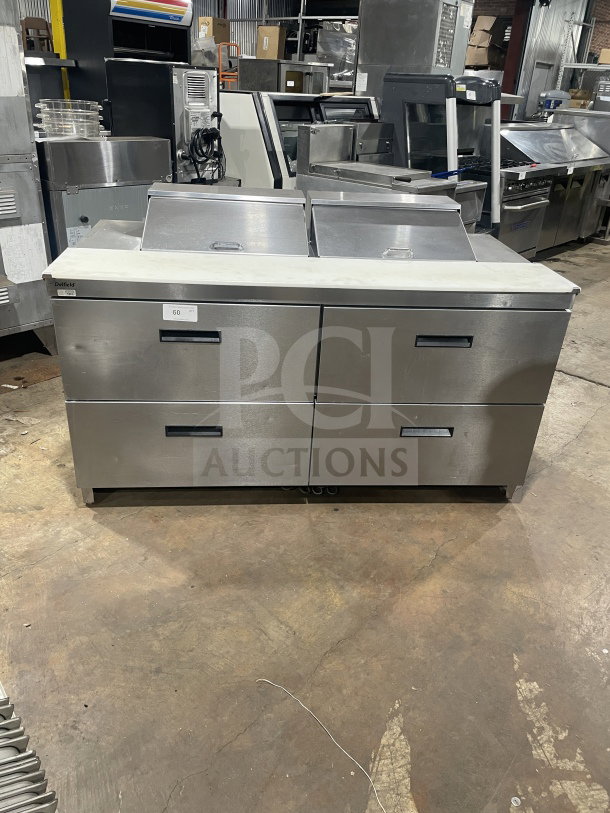 Delfield Manitowoc stainless steel 4-drawer sandwich prep table, model UCD4464N-12-DD5, with cutting board. 115V, 1 phase.