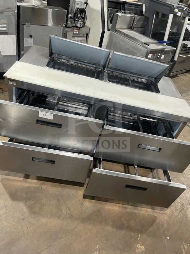 Delfield Manitowoc UCD4464N-12-DD5 commercial stainless steel 4-drawer sandwich prep table with cutting board, good condition.