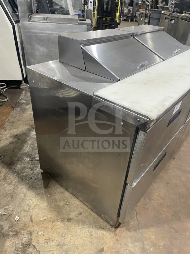 Delfield Manitowoc stainless steel 4-drawer refrigerated prep table, Model UCD4464N-12-DD5, with cutting board, 115V, good condition.