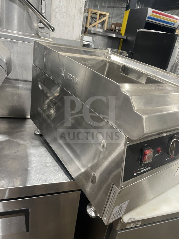 Omcan stainless steel electric countertop pasta cooker, model 41882, with basket holder. Features 240V power, excellent condition.