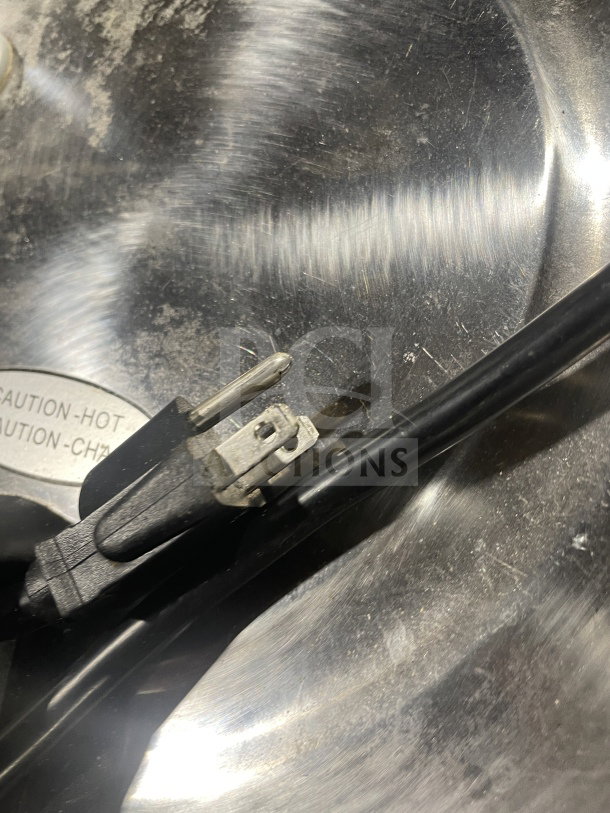 Amko AK-50RC stainless steel rice cooker, model AK-50RC, electric-powered, visible power cord, operational condition.