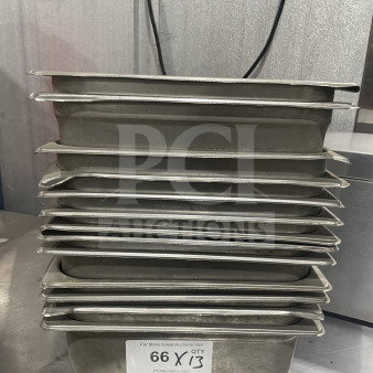 Stack of commercial stainless steel food storage trays, used for sauces or salads. Includes quantity label "66 X QTY 13".