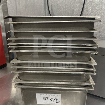 Commercial stainless steel food storage containers in a stack, labeled "67 x 12," indicating 12 items per bid.