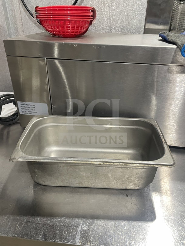 Commercial stainless steel food storage container, rectangular shape, used condition. Ideal for catering or restaurant use.