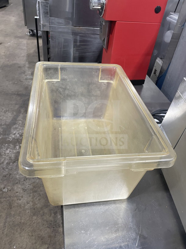 Commercial polycarbonate jumbo food storage container, transparent, spacious, durable, used condition, no visible tags.