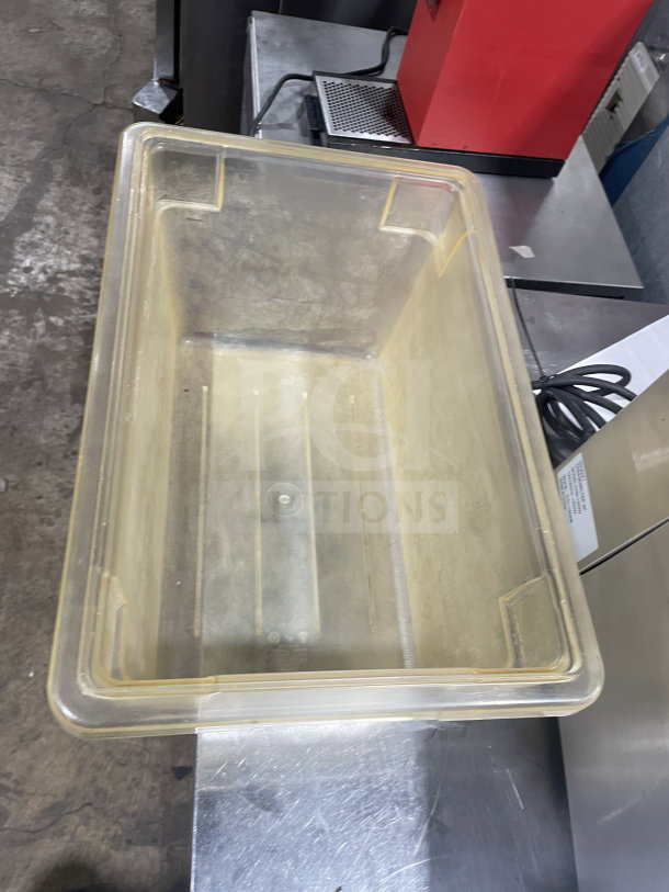 Commercial polycarbonate jumbo food storage container, transparent, durable. Used condition. Ideal for bulk storage.