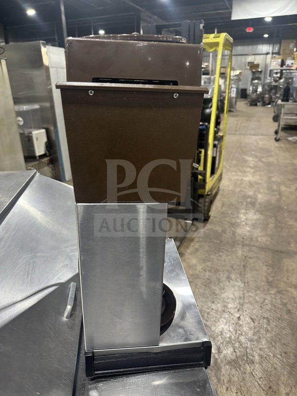 Cecilware commercial coffee machine countertop base, stainless steel, brown upper section, used condition, visible warehouse setting.