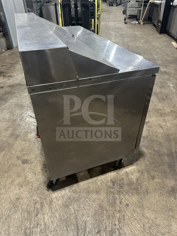 Beverage Air 60" stainless steel refrigerated bain-marie prep table on casters, featuring two doors and a poly coated rack.