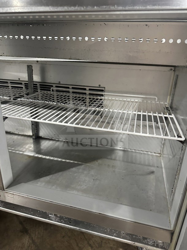 Beverage Air 60" stainless steel sandwich prep table with 2-door refrigerated storage, poly coated rack, and casters. 115V, 1 phase.