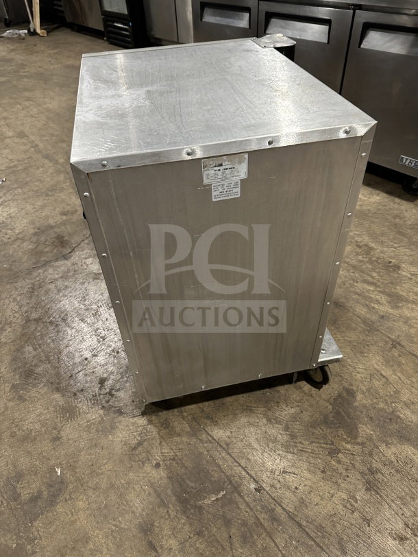 Metro Flavor Hold TC90B food warming cabinet, stainless steel, 120V, commercial-grade, visible label with specs, good condition.
