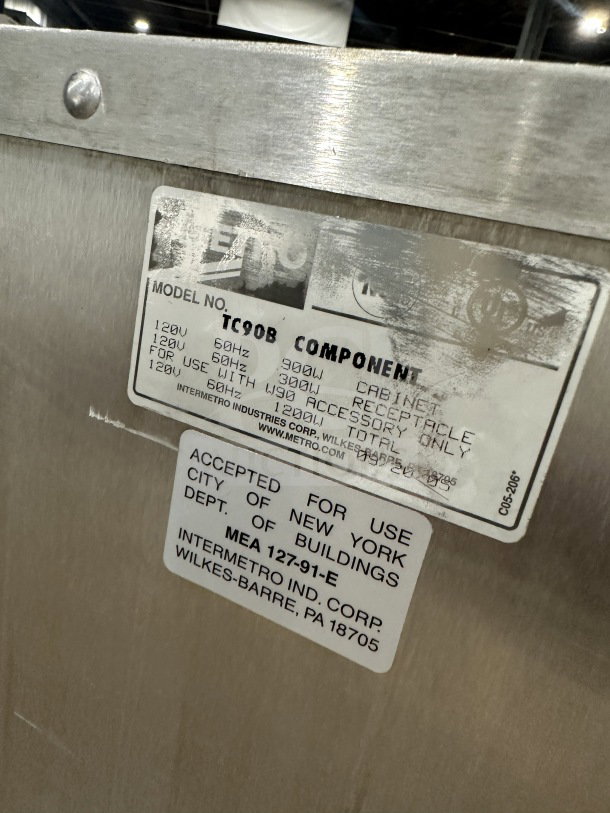 Commercial food warming cabinet, Metro Flavor Hold Model TC90B, 120V. Features visible labels, stainless steel finish.
